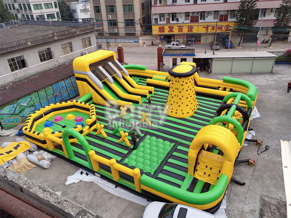Reuzen buiten water droog opblaasbaar pretpark Nationaal Indoor Big Bounce House met Wipe Out Game Slide Klimmuur